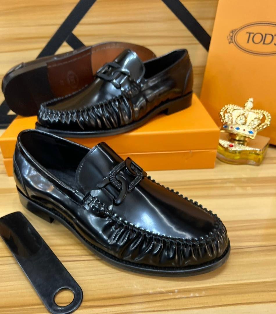 Tod’s Black Patent Leather Loafers