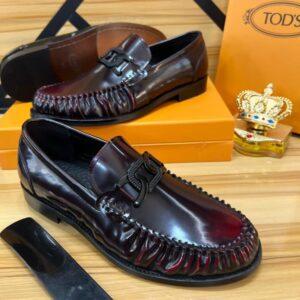Tod’s Burgundy Patent Leather Loafers