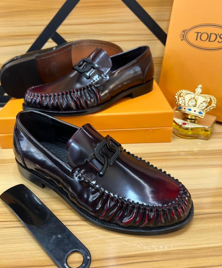Tod’s Burgundy Patent Leather Loafers